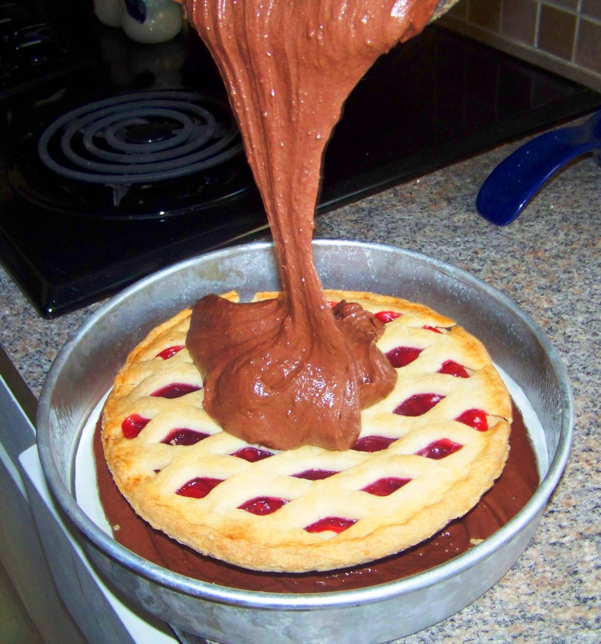 cherry pie with chocolate pouring on top